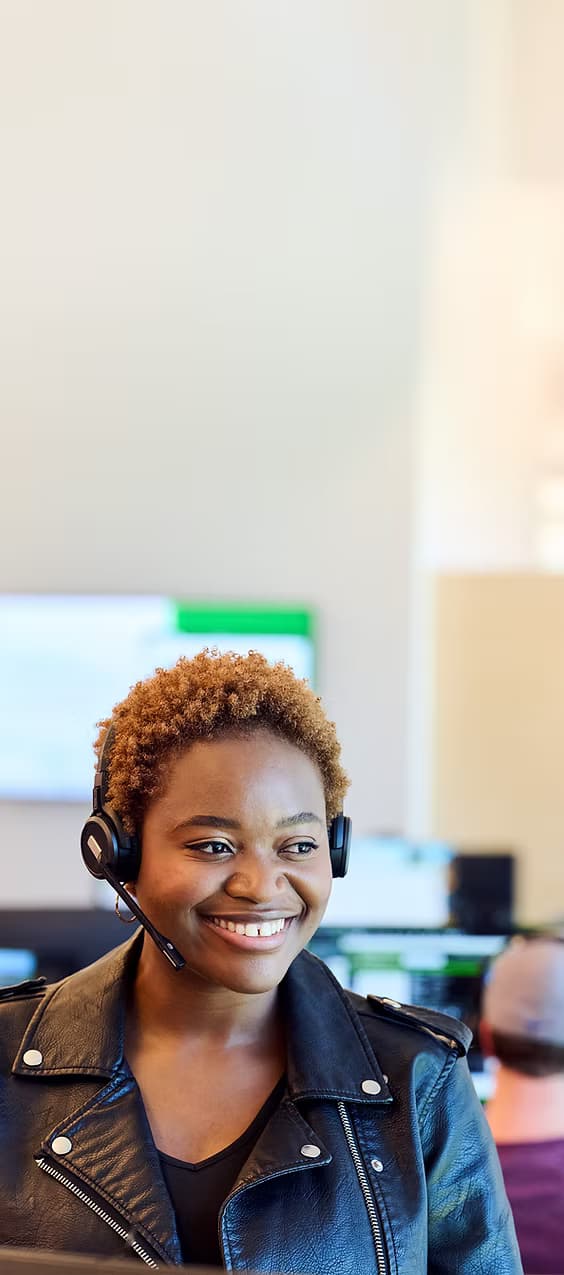 Person relaxing with pet while using phone